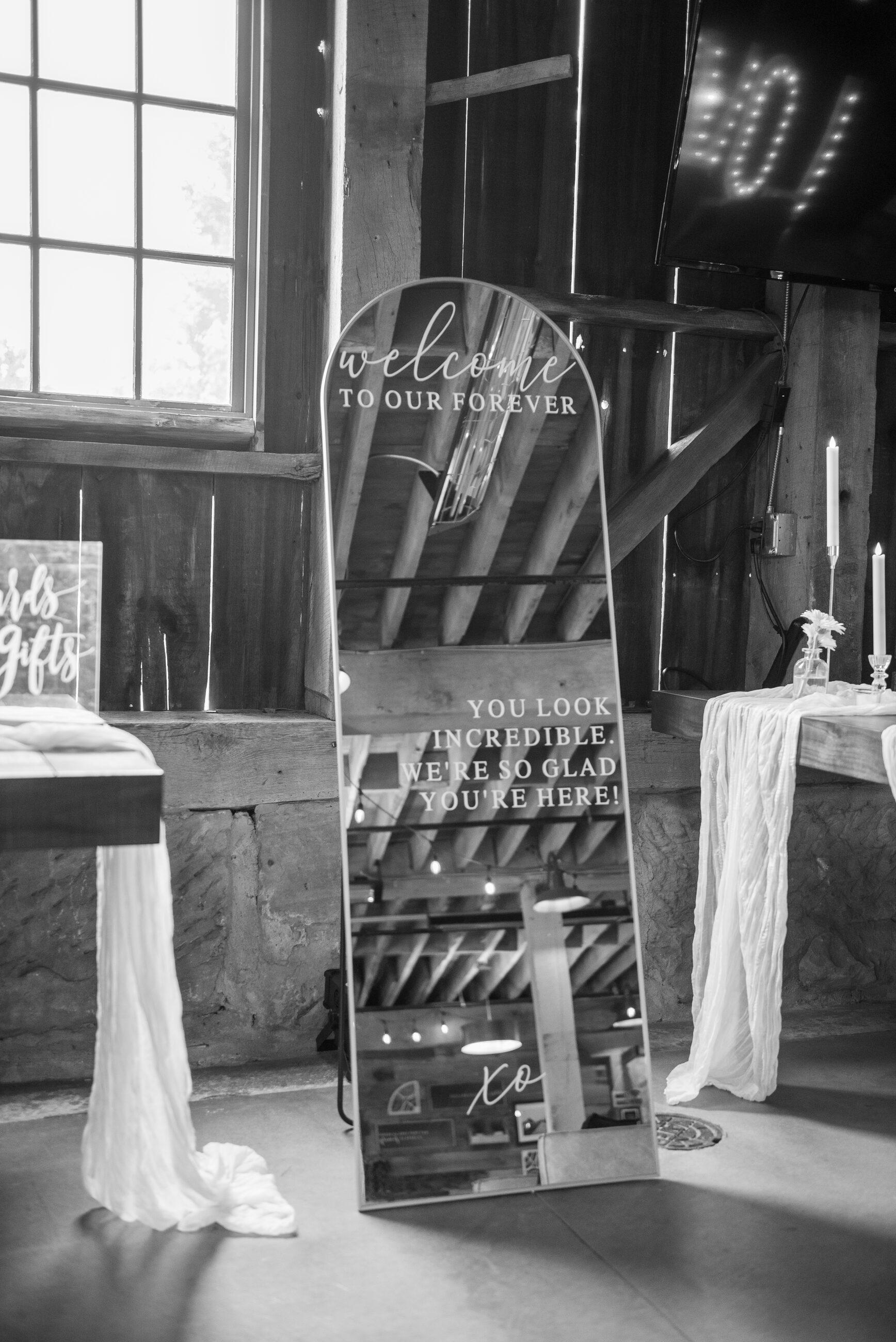 The barn threshold dressed for a wedding, in black and white